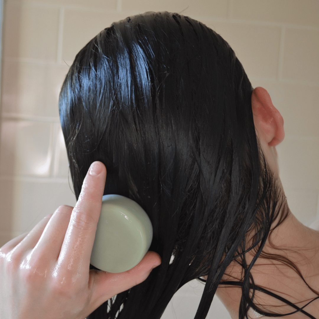 Olivskin Conditioner Block being applied directly to wet hair