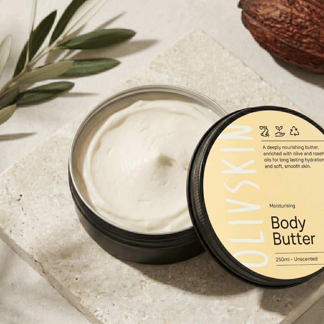 Open Olivskin Unscented Body Butter jar showing its rich creamy texture