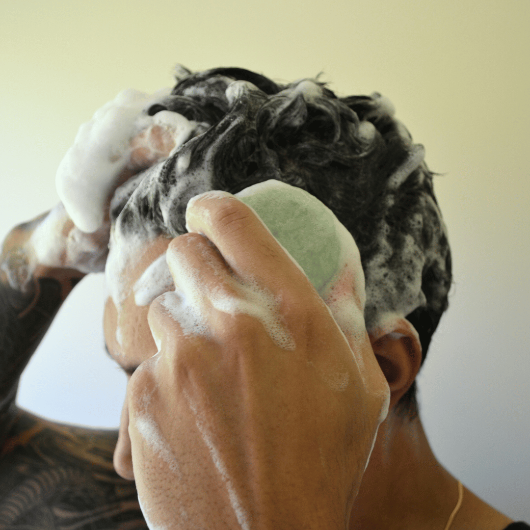 Olivskin Shampoo Block being applied directly to wet hair