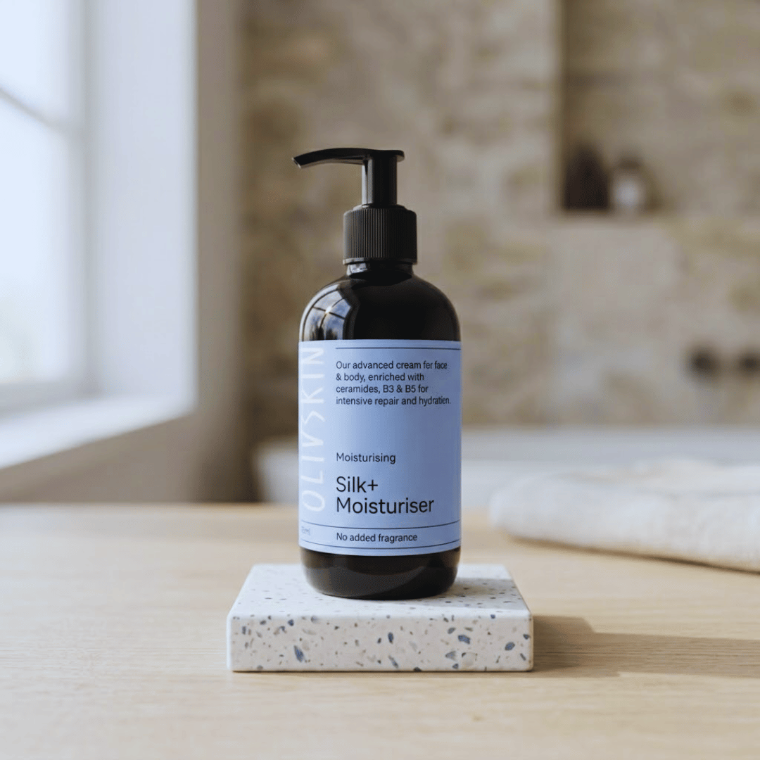Olivskin Silk+ Moisturiser bottle displayed in a bathroom