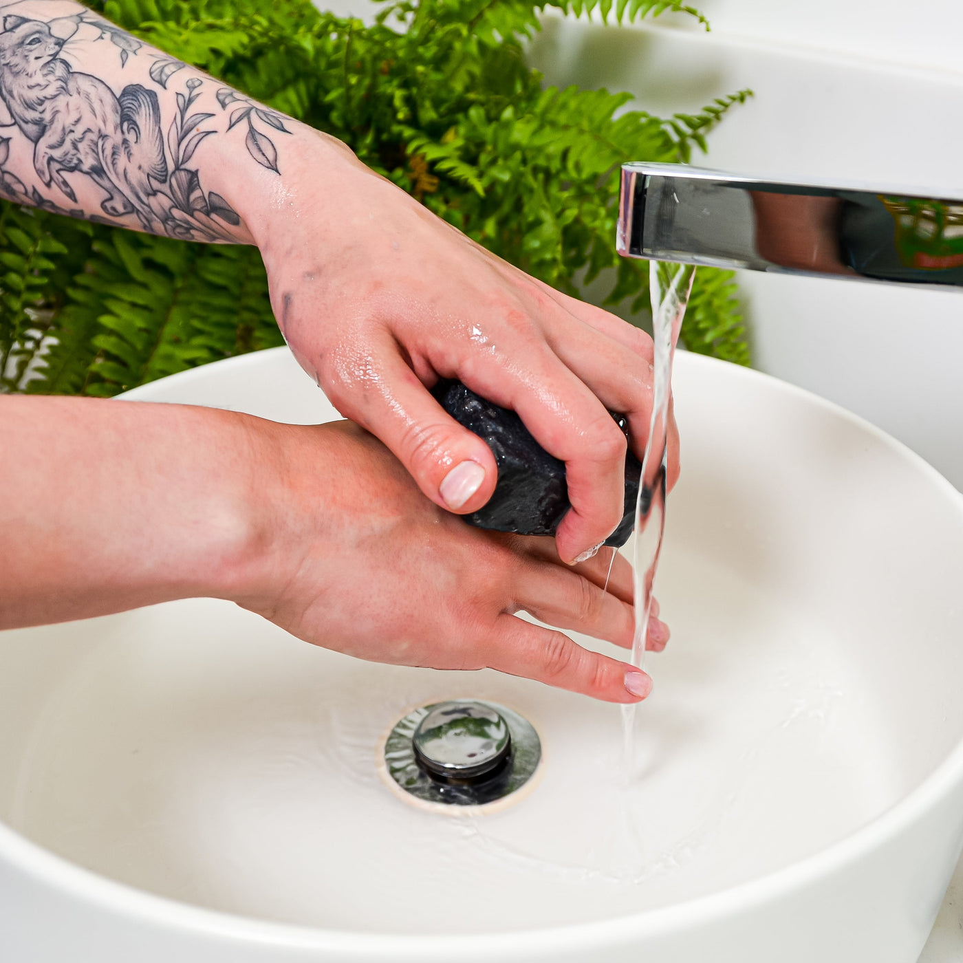 charcoal soap in use on hands