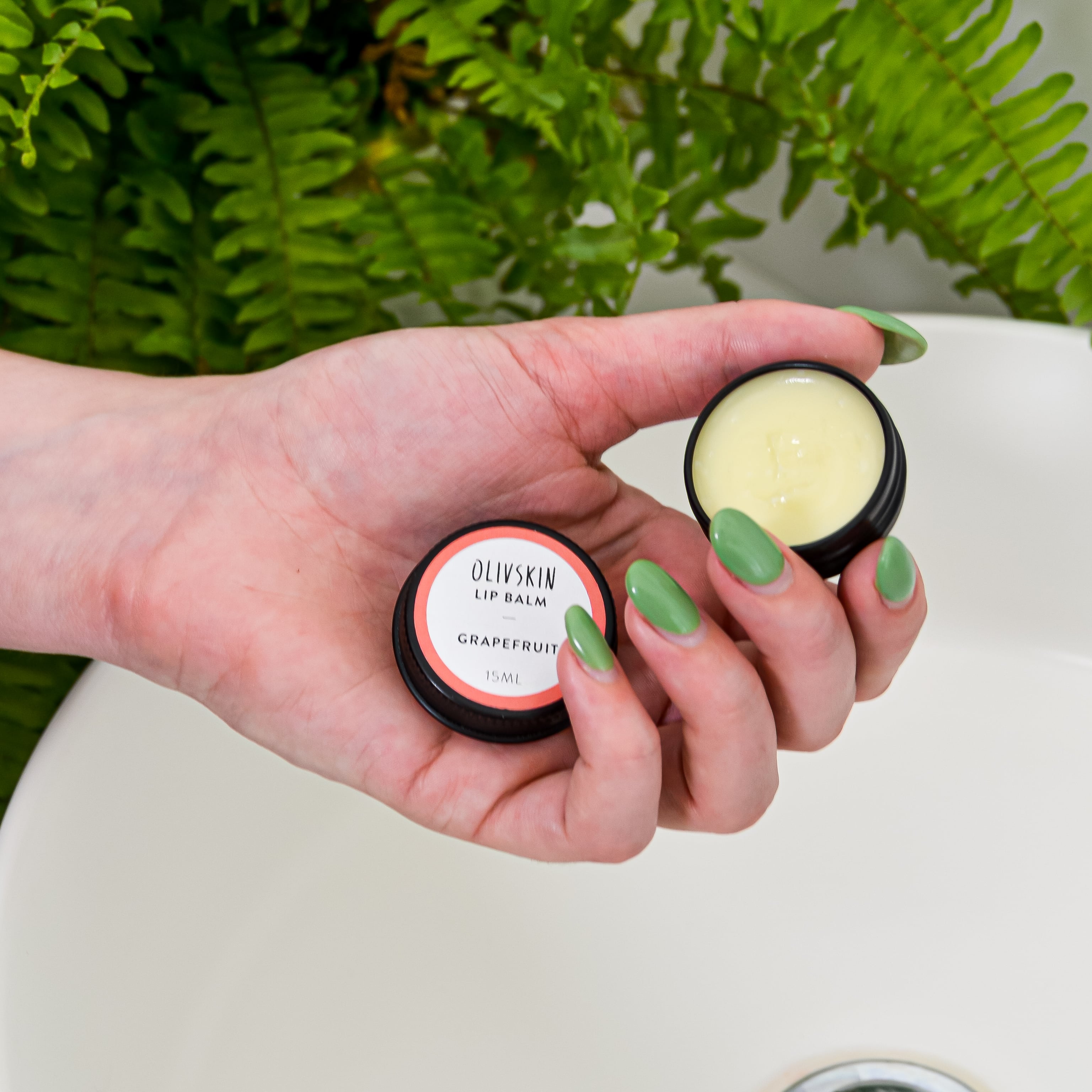 grapefruit lip balm in hand