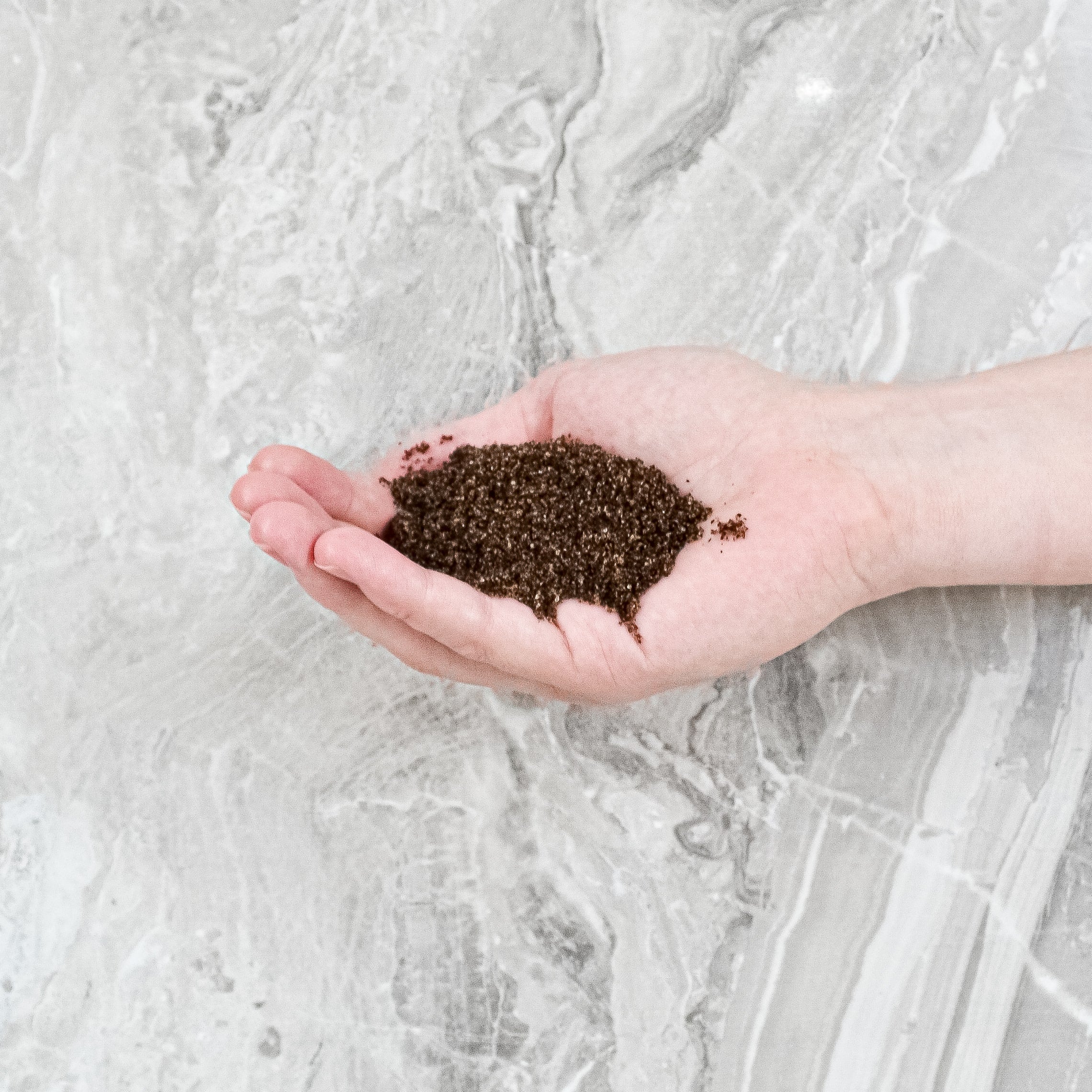 coffee body scrub in hand
