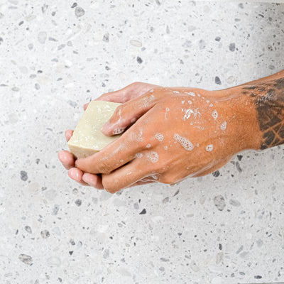 lemon and orange soap block in use